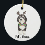 Personalized Bernedoodle Reindeer Bowtie Christmas Ceramic Ornament<br><div class="desc">I am in love with this beautifully detailed watercolor illustration of a grey, black, and white bernedoodle or sheepadoodle on an ornament with a sweet little antler and red & green bowtie combo! Personalize these ornaments and make the nice list this year! For the perfect presents, pair it with a...</div>