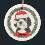 Personalized Bernedoodle Santa Hat Christmas Ceramic Ornament<br><div class="desc">I am in love with this beautifully detailed watercolor illustration of a grey, black, and white bernedoodle or sheepadoodle on an ornament in a sweet santa hat! Personalize these and make the nice list this year! For the perfect presents, pair it with a matching item from the collection for a...</div>