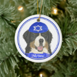 Personalized Bernese Mountain Dog Hanukkah Blue Ceramic Ornament<br><div class="desc">Celebrate your favorite mensch on a bench with personalized ornament! This design features a sweet illustration of a Bernese Mountain Dog with a blue and white yarmulke. For the most thoughtful gifts, pair it with another item from my collection! To see more work and learn about this artist, visit her...</div>