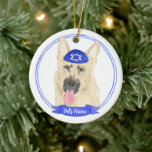 Personalized Black & Tan German Shepherd Hanukkah Ceramic Ornament<br><div class="desc">Celebrate your favorite mensch on a bench with personalized ornament! This design features a sweet illustration of a black and tan german shepherd dog with a blue and white yarmulke. For the most thoughtful gifts, pair it with another item from my collection! To see more work and learn about this...</div>
