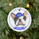 Personalized Black White Pied Frenchie Hanukkah Ceramic Ornament<br><div class="desc">Celebrate your favorite mensch on a bench with a personalized ornament! This design features a sweet illustration of a black and white pied frenchie or french bulldog with a blue and white yarmulke. For the most thoughtful gifts, pair it with another item from my collection! To see more work and...</div>