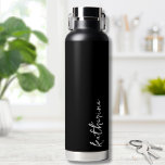 Personalized Black Your Name Script Minimalist Water Bottle<br><div class="desc">Simple yet stunning.  Personalize this water bottle with your name,  or a loved ones name.  A simple elegant script typography with a girly edge.  Change out the background and font colors to anything you want. Black White Trendy Simple Your Name Minimalist Water Bottle</div>