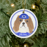Personalized Blenheim Cavalier Hanukkah Yarmulke Ceramic Ornament<br><div class="desc">Celebrate your favorite mensch on a bench with personalized ornament! This design features a sweet illustration of a red and white or blenheim cavalier king charles spaniel dog with a blue and white yarmulke. For the most thoughtful gifts, pair it with another item from my collection! To see more work...</div>