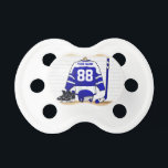 Personalized Blue and White Ice Hockey Jersey Pacifier<br><div class="desc">A personalized ice hockey jersey in blue and white hanging in a sports locker room with a helmet, ice skates and an ice hockey stick. The jersey can be fully customized with the number and name of your choice to make a great gift for the ice hockey fan, ice hockey...</div>