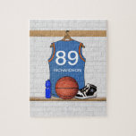 Personalized Blue Basketball Jersey Jigsaw Puzzle<br><div class="desc">Personalized light blue basketball jersey hanging in a locker room with a basketball , basketball sneakers and a drinks bottle. The jersey is customizable with your own numbers and name, to create a truly unique gift for the Basketball player or basketball fan. If you require a different color combination contact...</div>