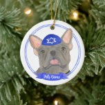 Personalized Blue Grey Frenchie Hanukkah Ceramic Ornament<br><div class="desc">Celebrate your favorite mensch on a bench with personalized ornament! This design features a sweet illustration of a blue grey french bulldog or frenchie dog with a blue and white yarmulke. For the most thoughtful gifts, pair it with another item from my collection! To see more work and learn about...</div>