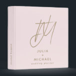 Personalized Blush and Gold Wedding Planner Binder<br><div class="desc">Stay organized and stylish with this personalized blush and gold wedding planner binder. Featuring a unique brush script 2 initial monogram with the couple’s name and "wedding planner" below in stylish font, this chic and romantic binder will keep all your wedding details in one place. The spine text is customizable,...</div>