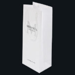 Personalized Bridesmaid's Monogram and Name Wine Gift Bag<br><div class="desc">Add a personal touch to your wedding with personalized bridesmaid's monogram and name gift. This design features personalized bridesmaid's name with title and wedding date in grey and monogram in light grey as background, in classic serif font style, on white background. Also perfect for maid of honor, mother of the...</div>