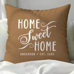 Personalized Brown Home Sweet Home Throw Pillow<br><div class="desc">Bring warmth and charm to your home with this personalized brown "Home Sweet Home" throw pillow. The elegant script and customizable family name create a welcoming touch for your living room or bedroom. The neutral color palette complements various home décor styles.</div>