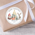 Personalized Christmas Gift Classic Round Sticker<br><div class="desc">Add a sprinkle of magic to your Christmas decorating with our delightful personalized stickers. These delightful watercolor images of Santa, a Christmas tree, gifts and a reindeer, come with an added personal touch - your child's initial and name. Instantly transform gift wrappings, cards, and decorations into something truly special, making...</div>