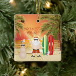 Personalized Cute Surfing Santa Beach Christmas Ceramic Ornament<br><div class="desc">This Warmest Wishes holiday Christmas ceramic ornament features a cute beach scene with Santa, surfboards, a sand snowman, seagulls, palm trees decorated with festive holiday lights and in the background the sun is setting over the water. The back can be personalized with a name, year or any text that you...</div>