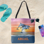 Personalized Dolphin Ocean Beach Gift for Her Tote Bag<br><div class="desc">A beautiful dolphin themed beach tote bag featuring dolphins leaping in front of a sunset with vibrant text. This template can be easily updated with any text you would like such as a name. This beach tote makes the perfect gift for someone special. If you need assistance with your personalization,...</div>