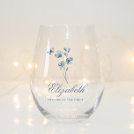 Personalized Dusty Blue Wildflower Bridal Shower Stemless Wine Glass<br><div class="desc">Elevate the toast to your special day with our enchanting Personalized Dusty Blue Wildflower Bridal Shower Stemless Wine Glass. This exquisite glassware isn't just a vessel for your favorite vino; it's a personalized bridal shower gift that captures the essence of your celebration. With delicate wildflowers dancing against a serene dusty...</div>