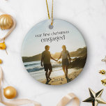 Personalized First Christmas Engaged Couple Photo  Ceramic Ornament<br><div class="desc">Celebrate your first Christmas as an engaged couple with this personalized ceramic ornament, featuring your favorite photo. This unique keepsake is perfect for commemorating your special moment, adding a meaningful touch to your holiday decor. The elegant design, combined with your personal photo, makes it a memorable addition to your tree...</div>