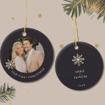 Personalized First Christmas Ornament<br><div class="desc">Celebrate a special milestone with this Personalized First Christmas ornament. Cherish your first holiday together as a couple with this exquisite ornament featuring a customizable photo framed by a delicate champagne gold snowflake on a rich dark background. The front elegantly displays 'Our First Christmas' in the lower thirds, capturing the...</div>