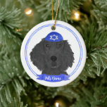 Personalized Flat Coated Retriever Dog Hanukkah Ceramic Ornament<br><div class="desc">Celebrate your favorite mensch on a bench with a personalized ornament! This design features a sweet illustration of a black flat coated retriever dog with a blue and white yarmulke. For the most thoughtful gifts, pair it with another item from my collection! To see more work and learn about this...</div>