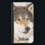 Personalized friendly wolf face samsung galaxy s5 wallet case<br><div class="desc">Close-up of a wolf face in a winter forest.  A cute friendly almost smiling face.  An animal with the fur in black,  white and brown. Personalize with your name on front,  black letters.</div>