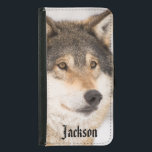 Personalized friendly wolf face samsung galaxy s5 wallet case<br><div class="desc">Close-up of a wolf face in a winter forest.  A cute friendly almost smiling face.  An animal with the fur in black,  white and brown. Personalize with your name on front,  black letters.</div>