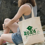 Personalized Graduate Class of 2024 Green Tote Bag<br><div class="desc">Graduate Class of 2024 quote features a cap with tassel,  modern topography and calligraphy script,  accented with florals and hearts.  Easily personalize with your name of choice and monogram on back.  Great gift idea for that special grad.  (School Color: Green)</div>
