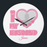 Personalized I Love My Husband – Add Photo & Name Large Clock<br><div class="desc">Find awesome, funny, and delightfully crazy gifts that perfectly capture your love! Whether you're hunting for romantic gift for wife ideas, best Valentine's gifts for her, meaningful wedding anniversary gifts for wife, or best Christmas gifts for wife, our unique designs add a playful twist. Surprise her with psychotically cute (in...</div>