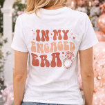 Personalized In my Engaged Era Future Mrs  T-Shirt<br><div class="desc">Celebrate Her Next Chapter with the Perfect Engagement Gift! Make the bride-to-be feel extra special with this cozy and stylish custom “Future Mrs.” T-shirt — a must-have for every fiancée entering her wedding era! The front of the shirt proudly features “Future Mrs.” alongside her customizable new last name, turning it...</div>