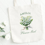 Personalized Lily of the Valley Bow Flower Girl Tote Bag<br><div class="desc">Celebrate your little wedding star in style with this effortlessly chic "Flower Girl" tote. Featuring a delicate lily of the valley floral bouquet tied in a loose, floppy coquette bow and customizable with her name, it’s the perfect blend of personal and practical. The soft pastel palette and elegant script make...</div>