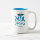 https://rlv.zcache.com/personalized_medical_assistant_coffee_mug-r2f44624edfdb47deb9f75bc9a05b7c02_kfpvr_8byvr_166.jpg