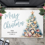 Personalized Name Beach Merry Christmas Doormat<br><div class="desc">Celebrate the season with this festive and beachy horizontal doormat, perfect for welcoming guests to your coastal holiday celebration. The design features a whimsical Christmas tree made of beach shells, starfish, and coral, bringing a fun tropical touch right to your doorstep. The color palette includes soft teal blue and tan...</div>