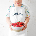 Personalized Name Monogram | Navy Kids' Apron<br><div class="desc">These personalized kids' aprons feature your child's name in a modern arched font, making them perfect for young chefs helping in the kitchen, creative dress-up play, or as artist smocks to protect clothes during crafting. Made from durable, easy-to-clean fabric, these aprons add a fun, personal touch while keeping your little...</div>