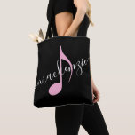 Personalized Name Music Note Black and Pink Tote Bag<br><div class="desc">Simple black and white and pink music note bag with your name printed on it with a modern and elegant handwritten calligraphy script font in black over an eighth note in pink. Text colors and fonts can be changed, making the book bag perfect for multiple kids to store their sheet...</div>