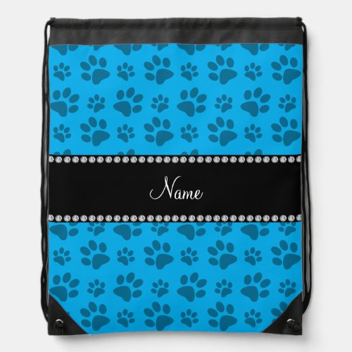 Personalized name sky blue dog paw prints drawstring bag