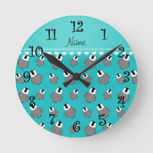 Personalized name turquoise baby penguins round clock