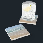 Personalized Ocean Beach House Stone Coaster<br><div class="desc">Add personalized style to your bathroom with this beach-themed stone coaster. The design features a one-of-a-kind photograph of the tranquil blue waves and soft sand of coastal Melbourne,  Australia. The modern,  white text is customizable so you can add your own family name.</div>