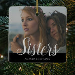 Personalized Photo Sisters Christmas tree Ceramic Ornament<br><div class="desc">A sisters photo christmas tree decoration can be changed to any relative. Featuring your favorite photograph,  the text 'Sisters' in a script font,  and their names over a black background.</div>