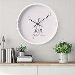 Personalized Pink Monogram Clock<br><div class="desc">Add a touch of elegance to your space with our Personalized Pastel Pink Monogram Clock. This custom timepiece features a chic pastel pink background with your chosen initial and name, making it a perfect addition to any room or a thoughtful gift for someone special. Crafted with attention to detail, this...</div>
