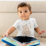 Personalized Pooh First Birthday Baby T-Shirt<br><div class="desc">Celebrate your little one's milestone with our Personalized Pooh First Birthday Baby T-Shirt. Featuring a playful design of Winnie the Pooh alongside the number "1, " this T-shirt is perfect for your baby’s first birthday celebration. Add a personal touch by customizing with your child’s name, creating a charming and memorable...</div>