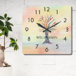 Personalized Rainbow Tree Square Wall Clock<br><div class="desc">This colourful Wall Clock is decorated with a mosaic family tree in the colors of the rainbow on a watercolor background.
Easily customizable with your name.
Because we create our own artwork you won't find this exact image from other designers.
Original Mosaic and Watercolor © Michele Davies.</div>