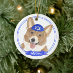 Personalized Red and White Corgi Dog Hanukkah Ceramic Ornament<br><div class="desc">Celebrate your favorite mensch on a bench with personalized ornament! This design features a sweet illustration of a red and white corgi dog with a blue and white yarmulke. For the most thoughtful gifts, pair it with another item from my collection! To see more work and learn about this artist,...</div>