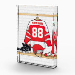 Personalized Red and White Ice Hockey Jersey Acrylic Award<br><div class="desc">A unique and fun sports design with a personalized ice hockey jersey hanging in a locker room with a helmet, ice skates and a hockey stick. The jersey can be fully personalized with the number and name of your choice to make a great gift for any ice hockey fan, ice...</div>