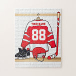 Personalized Red and White Ice Hockey Jersey Jigsaw Puzzle<br><div class="desc">A unique and fun sports design with a personalized ice hockey jersey hanging in a locker room with a helmet, ice skates and a hockey stick. The jersey can be fully personalized with the number and name of your choice to make a great gift for any ice hockey fan, ice...</div>