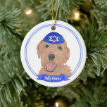 Personalized Red Apricot Gold Doodle Dog Hanukkah Ceramic Ornament<br><div class="desc">Celebrate your favorite mensch on a bench with personalized ornament! This design features a sweet illustration of a red, apricot, or golden doodle dog with a blue and white yarmulke. For the most thoughtful gifts, pair it with another item from my collection! To see more work and learn about this...</div>