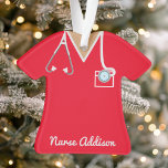 Personalized Red Nurse Scrubs Ornament<br><div class="desc">Celebrate the dedication of a nurse in your life with this personalized red nurse scrubs ornament, featuring a stethoscope and badge details. Perfect for holiday decorating or as a thoughtful gift for nurses, this ornament brings a touch of appreciation to any tree. Ideal for nurse graduations, new jobs, or Christmas...</div>