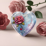 Personalized Red Rose Ruby Heart Paperweight<br><div class="desc">Elevate your gifting with our Personalized Red Rose Ruby Heart Paperweight. This heart-shaped glass treasure features a stunning illustration of a red rose adorned with a heart-shaped ruby pendant, set against a dreamy fairy tale-like background in shades of blue, purple, and white. The design is personalized with a stylish swirly...</div>