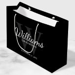 Personalized Script Groomsmen's name and Monogram  Large Gift Bag<br><div class="desc">Add a personal touch to your wedding with personalized groomsmen gift bag. This gift bag features personalized groomsman's name in white classic script font style with wedding details in white classic serif font style and monogram in grey classic serif font style as background, on black background. Also perfect for best...</div>