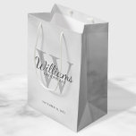 Personalized Script Groomsmen's name and Monogram  Medium Gift Bag<br><div class="desc">Add a personal touch to your wedding with personalized groomsmen gift bag. This gift bag features personalized groomsman's name in grey classic script font style with wedding details in grey classic serif font style and monogram in light grey classic serif font style as background, on white marble background. Also perfect...</div>