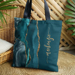 Personalized Signature Teal Blue Gold Agate Tote Bag<br><div class="desc">Personalize this elegant modern design with your name in vertical gold-colored signature handwriting script on a teal blue background with a border of teal blue watercolor agate trimmed with gold faux glitter. (To keep the swashes at the beginning and end of the name, replace only the letters, leaving the symbols...</div>