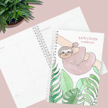 Personalized Sloth Planner<br><div class="desc">This cute Planner is decorated with a watercolor of a smiling sloth hanging from a branch with tropical leaves. On the back, it says Sloth Life and you can change these words if you wish. Easily customizable. Use the Design Tool option to change the text size, style, and color. Because...</div>