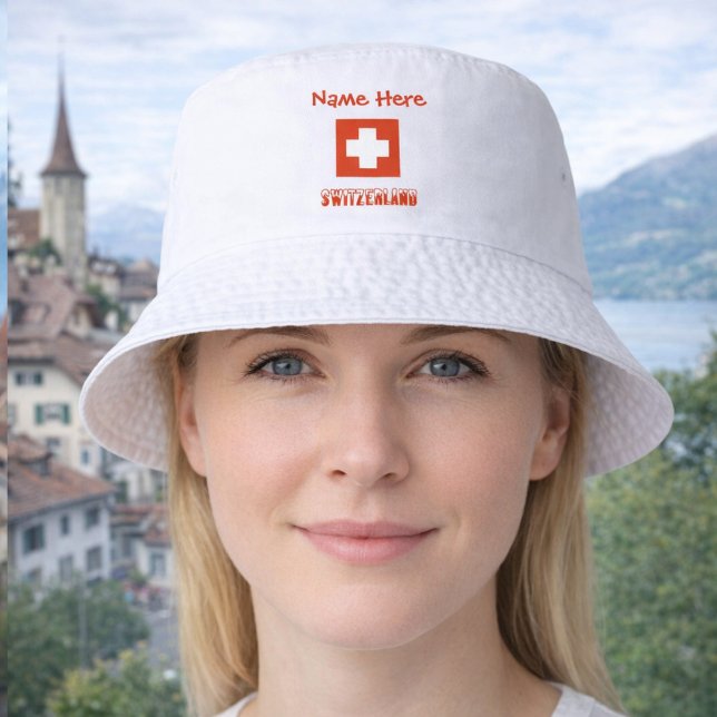 Personalized Switzerland Flag Bucket Hat (Personalized bucket hat has Swiss Flag and SWITZERLAND below. Above is a spot for a name in red text)