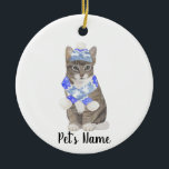 Personalized Tabby Cat (Grey) Blue Ski Hat & Scarf Ceramic Ornament<br><div class="desc">Make the nice list this year with an ornament of your favorite tabby cat elf! For the sweetest gifts, pair it with a matching art print or another item from my collection for a thoughtful housewarming, cat mom, bridal shower, teacher, mother-in-law, husband, boyfriend, secret santa, sympathy, or tough-to-shop-for gift! To...</div>