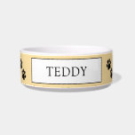 Personalized "Teddy" Paw Print Pet Bowl<br><div class="desc">Treat your furry friend to their very own personalized bowl! This adorable ceramic pet bowl features a charming paw print design on a soft yellow background. The center is personalized with the name "TEDDY" in a classic font, making it easy to identify your pet's dish. Durable and easy to clean,...</div>